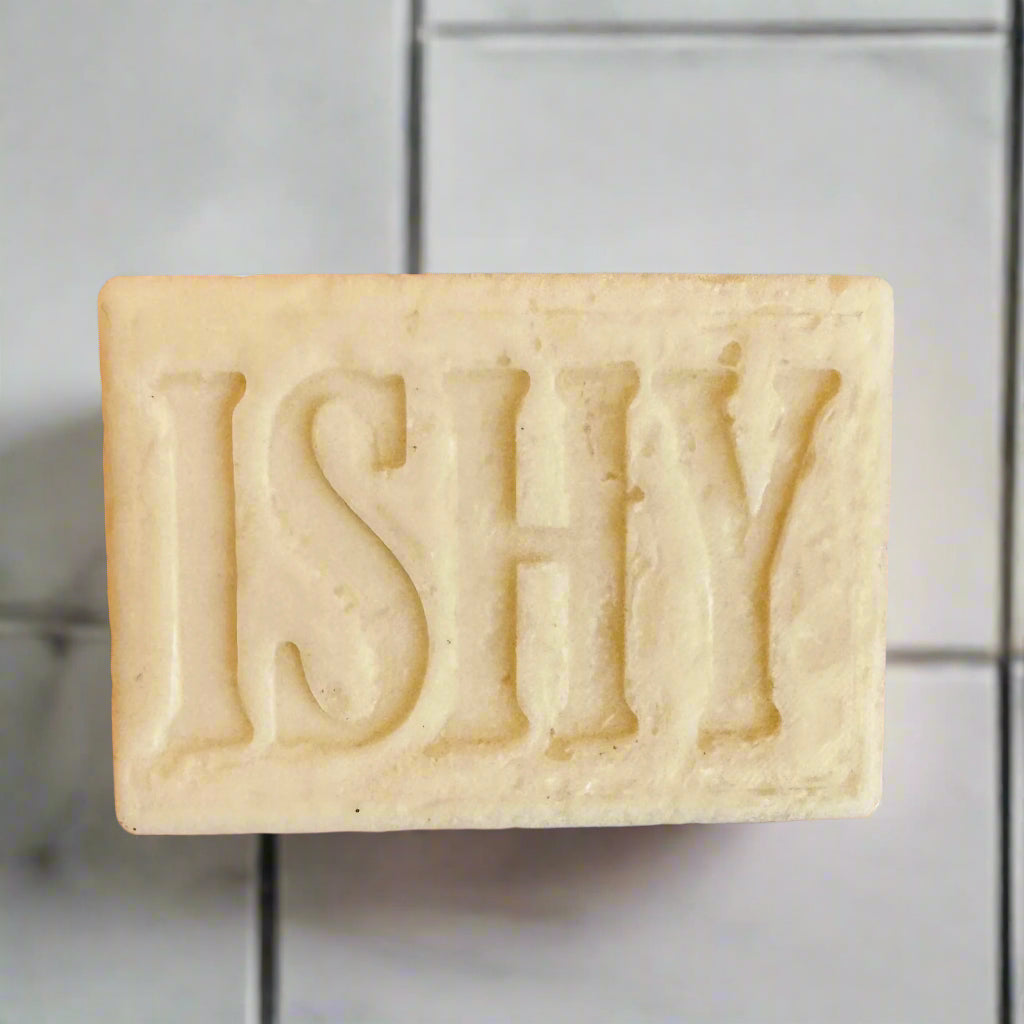 This is the original ISHY soap bar. It is an off white or ivory color and is 1 inch x 2.5 inches x 3 inches. It has the word ISHY stamped into the front of the bar of soap.